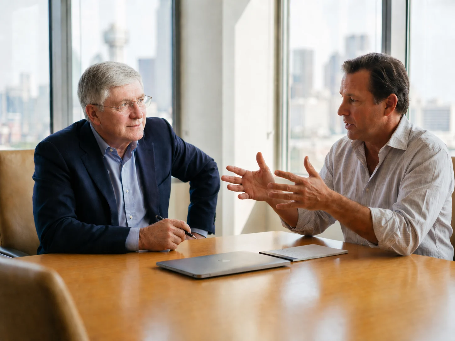 A Consulting Collaborative Strategic Assessment interview in progress — the consultant listens intently while an employee explains operations, Dallas skyline visible through the window.